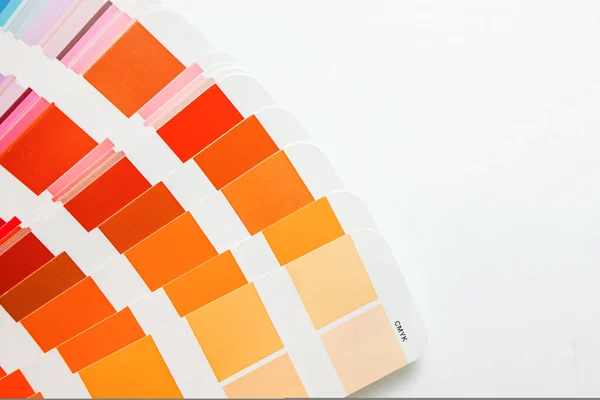 Color guide swatches of orange and red warm tones and peach color