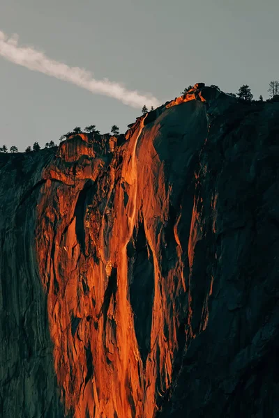 Horse tail waterfall in Yosemite national park glowing in sunset light in February, Fire fall phenomena, California, USA