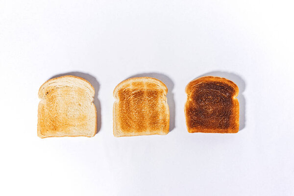 Three slices of bread toasted for a different level, sandwich square slices