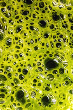 Yeşil karışımlı smoothie 'nin yakın çekim makro görüntüsü, sağlıklı beslenme