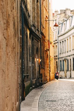 Old scenic street in sunset light in Bordeaux, France