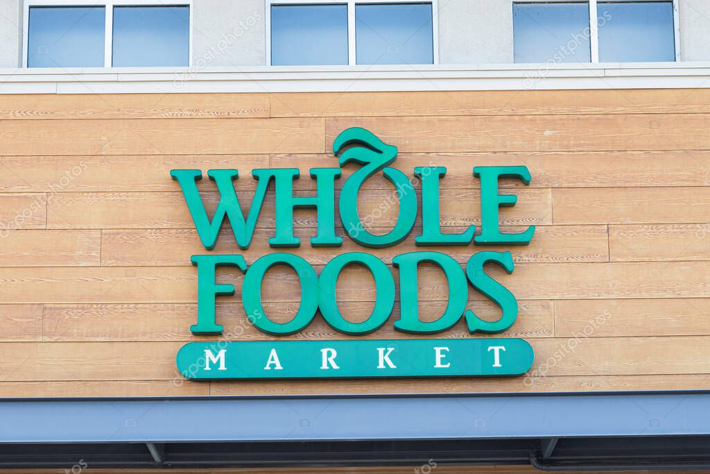 Dublin, California, USA - June 7, 2024: Close-up view of an entrance sign of a Whole Foods Market.