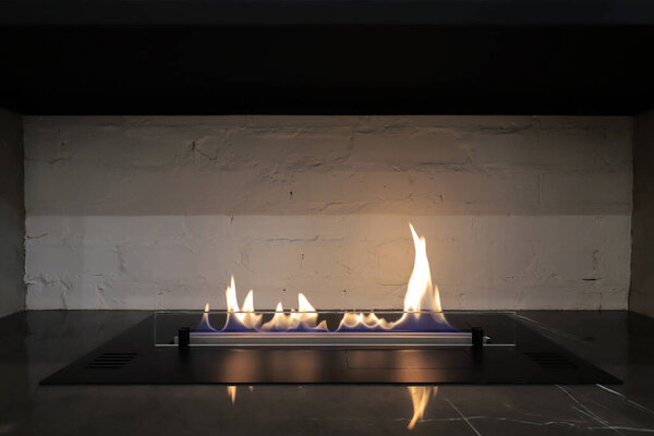 Burning eco bio fireplace close-up in the home interior