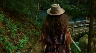 Follow me footage of a girl dressed in Asian style.