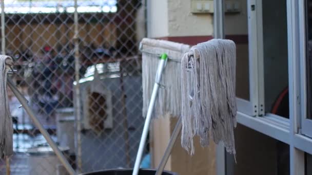 Mops Drying Backyard House — Stock Video