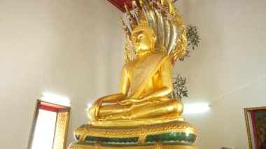 golden buddha statue in bangkok temple.