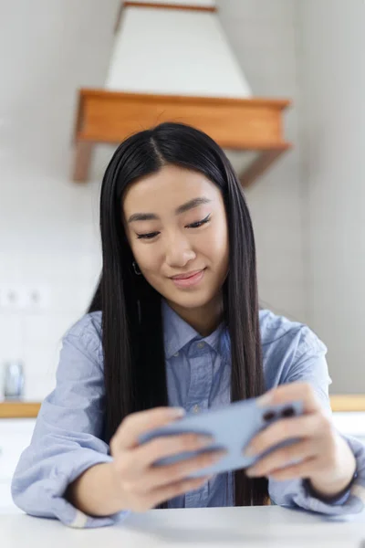 Gamer Girl Plays Mobile Game Smartphone Cheerful Vietnamese Bipoc Female — Stockfoto