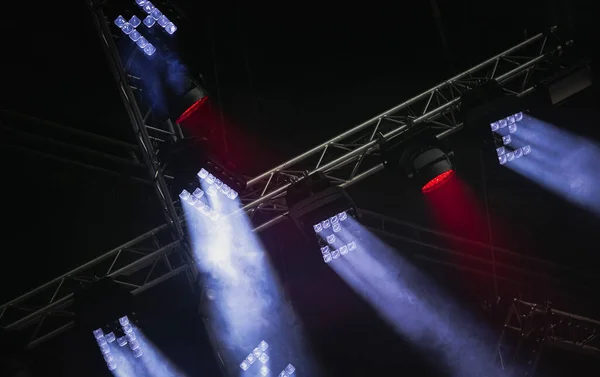 Concert LED lighting mounted on metal bars above the stage
