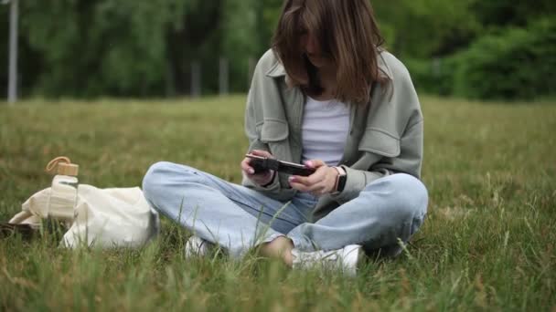 Young Gamer Girl Playing Mobile Game Smart Phone Gamepad Attached — Video