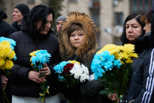 Ukrainian women bring flowers on the memorial ceremony dedicated to the fallen activists of Maidan on the Day of the Heroes of the Heavenly Hundred. Kyiv - 20 February, 2024