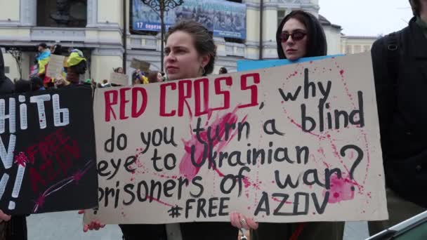 Ukrainian Activist Holds Banner Red Cross Why You Turn Blind — Stock Video