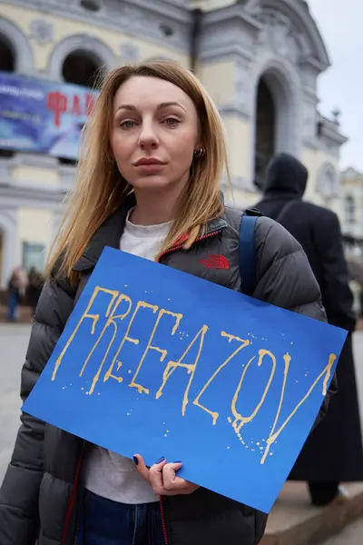 stock image Ukrainian woman posing with a poster 