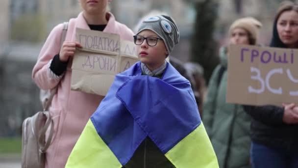 Young Ukrainian Boy Wearing National Flag Shoulders Public Demonstration Raise — Stock Video