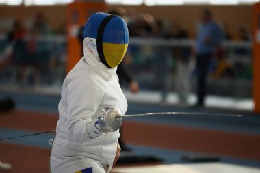 Ukrayna Milli Eskrim Takımı üyesi Ukrayna 'nın kapalı alanda şampiyonluğu için çiş bıçağıyla dövüşüyor. Kyiv - 30 Mart 2024