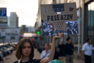 Young Ukrainian girl demonstrating with a sign 