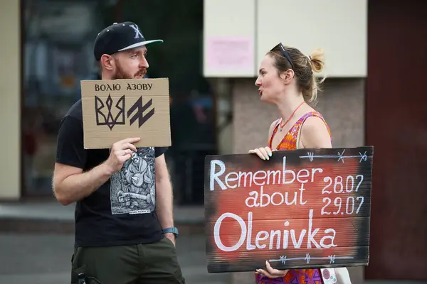 stock image Ukrainian activists demonstrating with banners dedicated to captured Azov brigade soldiers and Olenivka tragedy. Kyiv - 18 August,2024