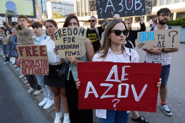 Large group of people demonstrating with banners Free Azov at a public protest against russian captivity. Kyiv - 8 September,2024 clipart