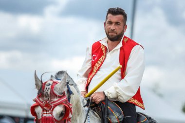 Turkish horseback javelin thrower at Etnospor Kultur Festivali. Istanbul - 11 May,2018 clipart