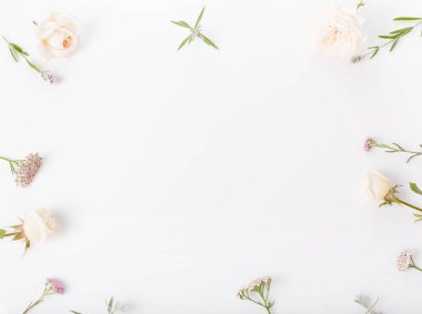 Festive flower rose composition on the white background. Overhead top view, flat lay. Copy space. Birthday, Mothers, Valentines, Womens, Wedding Day concept.