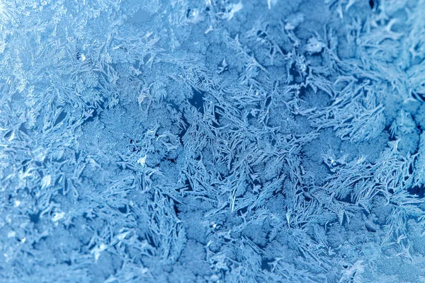 Beautiful natural frosty pattern on winter window, ice frosty