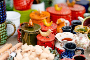 Ceramic dishes, tableware and jugs sold on Easter market in Vilnius. Lithuanian capital's annual traditional crafts fair is held every March on Old Town streets. clipart