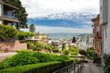 SAN FRANCISCO, USA - APRIL 2016: Famous Lombard street, one of the most famous landmark and the crookedest street in the world. San Francisco, California, USA clipart