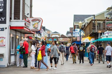 SAN FRANCISCO, USA - APRIL 2016: Visitors flock to Pier 39 at San Francisco's Fisherman's Wharf renowned for its varied attractions, shops and seafood.