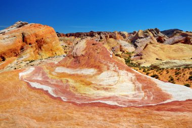Beautiful red and white stripes of the Crazy Hill sandstone formation in Valley of Fire State Park, Nevada, USA. Exploring the American Southwest.
