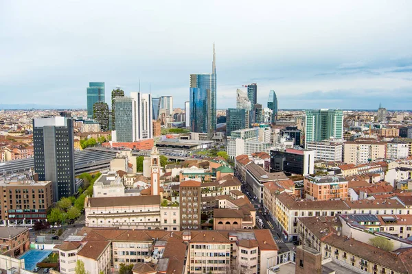 Aerial view of Milan skyline with modern skyscrapers in Porto Nuovo business district, Italy. Panorama of Milano city. Spring panoramic view of Milan from above. Milan, Lombardy, Italy.