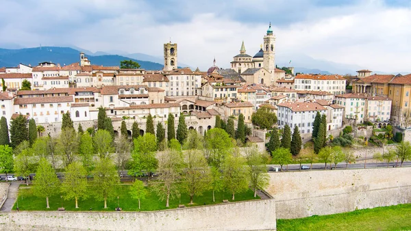 stock image Scenic aerial view of Bergamo city northeast of Milan. Flying over Citta Alta, town's upper district, known by cobblestone streets and encircled by Venetian walls. Bergamo, Lombardy, Italy.