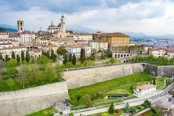 stock image Scenic aerial view of Bergamo city northeast of Milan. Flying over Citta Alta, town's upper district, known by cobblestone streets and encircled by Venetian walls. Bergamo, Lombardy, Italy.