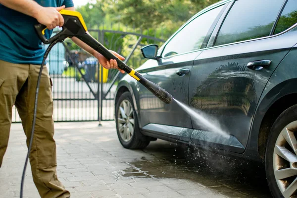 Young Man Using Water Gun Wash His Car Male Driver — Stockfoto