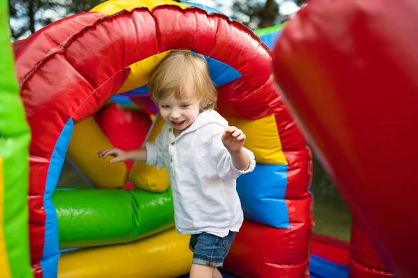 Cute Toddler Boy Jumping Inflatable Bouncer Backyard Warm Sunny Summer — Stock Photo, Image