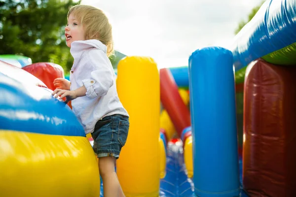 Cute Toddler Boy Jumping Inflatable Bouncer Backyard Warm Sunny Summer — Stock Photo, Image