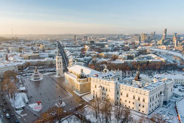 Beautiful sunny Vilnius city scene in winter. Christmas tree on the Cathedral square. Aerial early evening view. Winter city scenery in Vilnius, Lithuania.