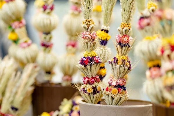 Traditional Lithuanian Easter palms known as verbos sold on Kaziukas, Easter market in Vilnius. Lithuanian capital\'s annual traditional crafts fair is held every March on Old Town streets.