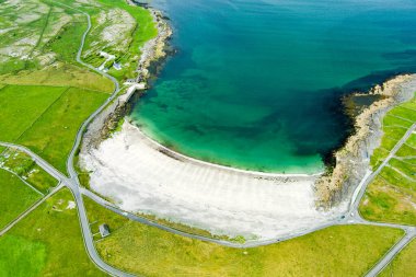 Aerial view of the wide sandy Kilmurvey Beach on Inishmore, the largest of the Aran Islands in Galway Bay, Ireland.