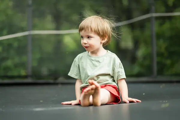 Cute Little Boy Jumping Trampoline Backyard Warm Sunny Summer Day — Stock Photo, Image