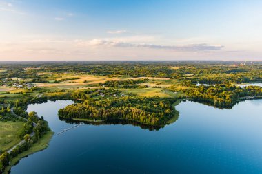 Beautiful aerial view of lake Galve, one of most popular lakes among water-based tourists, divers and holiday makers, located in Trakai, Lithuania. clipart