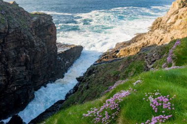 Polifreann or Hells Hole at Malin Head, Ireland's northernmost point, Wild Atlantic Way, spectacular coastal route. Wonders of nature. Numerous Discovery Points. Co. Donegal clipart