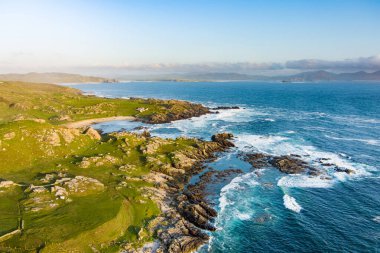 Ineuran Bay coast and cliffs, Malin Head, Ireland's northernmost point, famous Wild Atlantic Way, spectacular coastal route. Wonders of nature. Numerous Discovery Points. Co. Donegal clipart