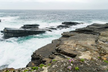 Spectacular Kilkee Cliffs, situated at the Loop Head Peninsula, remote and wild stretch of stunning coastline, Wild Atlantic Way Discovery Point, county Clare, Ireland. clipart