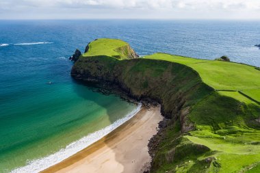 Silver Strand, a sandy beach in a sheltered, horseshoe-shaped bay, situated at Malin Beg, near Glencolmcille, in south-west County Donegal. Wild Atlantic Way, spectacular coastal route in Ireland. clipart