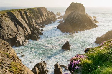 Scheildren, most iconic and photographed landscape at Malin Head, Ireland's northernmost point, Wild Atlantic Way, spectacular coastal route. Wonders of nature. Numerous Discovery Points. Co. Donegal clipart