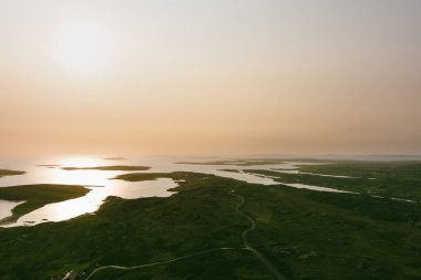 Spectacular sunset view of Ardmore and Turbot islands from famous scenic Sky Road, 15km looped drive starting in Clifden with numerous brilliant viewing points, Wild Atlantic Way, Connemara, Ireland. clipart