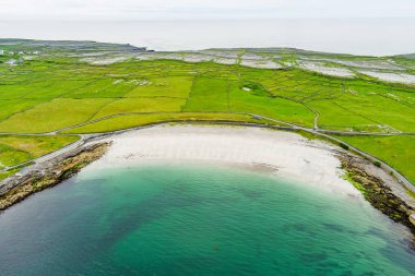 Aerial view of the wide sandy Kilmurvey Beach on Inishmore, the largest of the Aran Islands in Galway Bay, Ireland. clipart