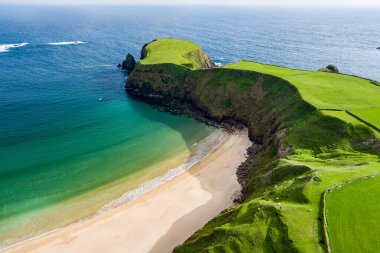 Silver Strand, a sandy beach in a sheltered, horseshoe-shaped bay, situated at Malin Beg, near Glencolmcille, in south-west County Donegal. Wild Atlantic Way, spectacular coastal route in Ireland. clipart