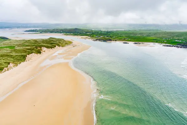 Five Finger Strand, one of the most famous beaches in Inishowen known for its pristine sand and surrounding rocky coastline with some of the highest sand dunes in Europe, county Donegal, Ireland.