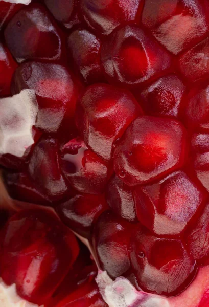 red grains of pomegranate close-up, macro