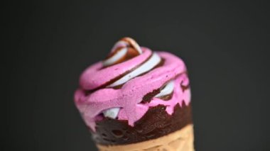 ice cream in a waffle cone on a black background